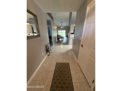This Johnson-built block home is move in ready, located in the on Turnbull Bay Golf Club in Florida - for sale on GolfHomes.com, golf home, golf lot