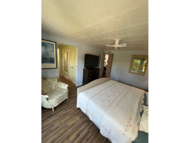 This charming two-bedroom, two-bath home is located in the gated on Lake Fairways Country Club in Florida - for sale on GolfHomes.com, golf home, golf lot