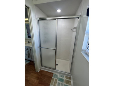 This charming two-bedroom, two-bath home is located in the gated on Lake Fairways Country Club in Florida - for sale on GolfHomes.com, golf home, golf lot