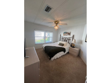 This charming two-bedroom, two-bath home is located in the gated on Lake Fairways Country Club in Florida - for sale on GolfHomes.com, golf home, golf lot