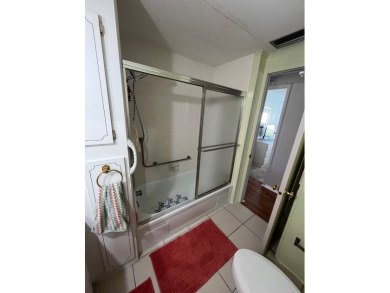 This charming two-bedroom, two-bath home is located in the gated on Lake Fairways Country Club in Florida - for sale on GolfHomes.com, golf home, golf lot