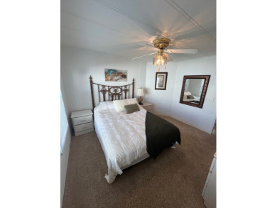 This charming two-bedroom, two-bath home is located in the gated on Lake Fairways Country Club in Florida - for sale on GolfHomes.com, golf home, golf lot