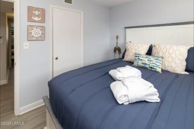 Uncover paradise in this stunning top-floor end unit on Hilton on Palmetto Dunes Golf Course and Resort in South Carolina - for sale on GolfHomes.com, golf home, golf lot