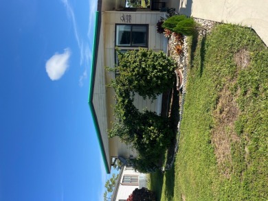 This charming two-bedroom, two-bath home is located in the gated on Lake Fairways Country Club in Florida - for sale on GolfHomes.com, golf home, golf lot