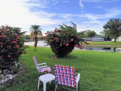 This charming two-bedroom, two-bath home is located in the gated on Lake Fairways Country Club in Florida - for sale on GolfHomes.com, golf home, golf lot