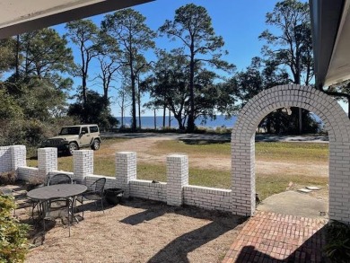 Enjoy waterfront views at this Coastal cottage located one on St. James Bay in Florida - for sale on GolfHomes.com, golf home, golf lot