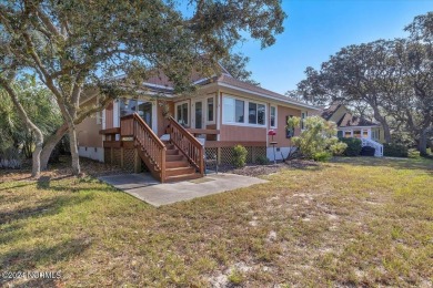 Enjoy true Coastal living at this stunning 3 bedroom, 2-bath on Oak Island Golf Club in North Carolina - for sale on GolfHomes.com, golf home, golf lot