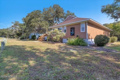 Enjoy true Coastal living at this stunning 3 bedroom, 2-bath on Oak Island Golf Club in North Carolina - for sale on GolfHomes.com, golf home, golf lot