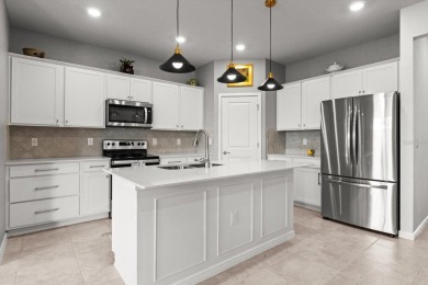 Welcome to 9459 SW 52nd Loop, a beautifully enhanced Cedar model on Stone Creek Golf Club in Florida - for sale on GolfHomes.com, golf home, golf lot