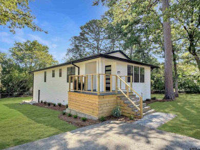 Welcome to 401 Hideaway Ln E -- a fully refreshed 3-bedroom for sale on GolfHomes.com