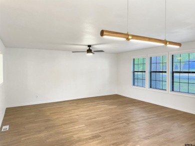 Welcome to 401 Hideaway Ln E -- a fully refreshed 3-bedroom on Hide-A-Way Lake Golf Course in Texas - for sale on GolfHomes.com, golf home, golf lot