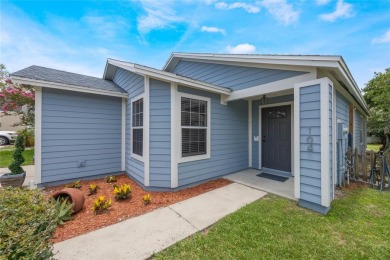 Experience breathtaking lake views from this adorable 3 bedroom on Mayfair Country Club in Florida - for sale on GolfHomes.com, golf home, golf lot