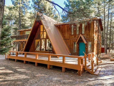 Welcome to 50 Knollwood Way, a quintessential A-frame chalet on Angel Fire Resort Country Club in New Mexico - for sale on GolfHomes.com, golf home, golf lot
