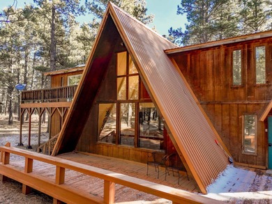 Welcome to 50 Knollwood Way, a quintessential A-frame chalet on Angel Fire Resort Country Club in New Mexico - for sale on GolfHomes.com, golf home, golf lot