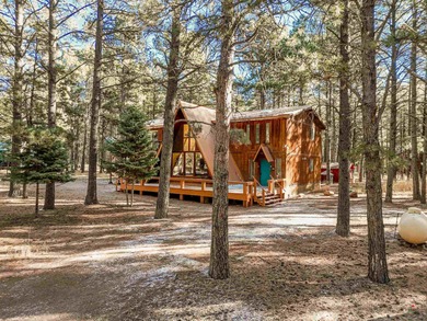 Welcome to 50 Knollwood Way, a quintessential A-frame chalet on Angel Fire Resort Country Club in New Mexico - for sale on GolfHomes.com, golf home, golf lot