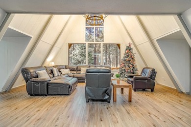 Welcome to 50 Knollwood Way, a quintessential A-frame chalet on Angel Fire Resort Country Club in New Mexico - for sale on GolfHomes.com, golf home, golf lot