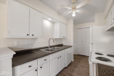 This upper-floor 2-bedroom condo offers beautiful views of the on Marysville Golf Course in Michigan - for sale on GolfHomes.com, golf home, golf lot