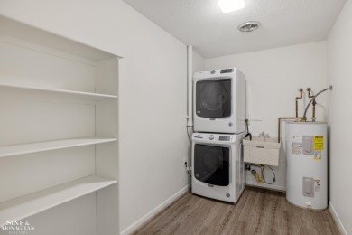 This upper-floor 2-bedroom condo offers beautiful views of the on Marysville Golf Course in Michigan - for sale on GolfHomes.com, golf home, golf lot