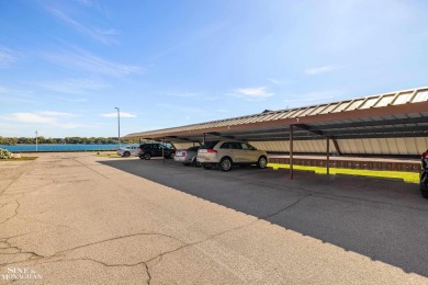 This upper-floor 2-bedroom condo offers beautiful views of the on Marysville Golf Course in Michigan - for sale on GolfHomes.com, golf home, golf lot