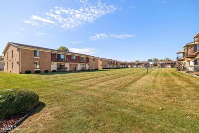 This upper-floor 2-bedroom condo offers beautiful views of the on Marysville Golf Course in Michigan - for sale on GolfHomes.com, golf home, golf lot