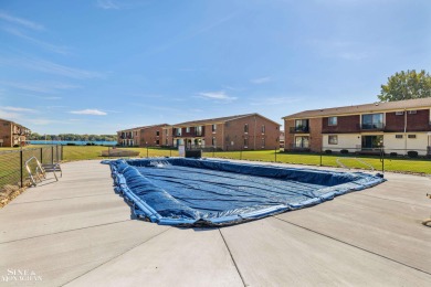 This upper-floor 2-bedroom condo offers beautiful views of the on Marysville Golf Course in Michigan - for sale on GolfHomes.com, golf home, golf lot