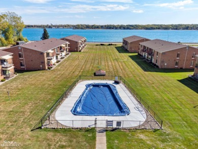 This upper-floor 2-bedroom condo offers beautiful views of the on Marysville Golf Course in Michigan - for sale on GolfHomes.com, golf home, golf lot