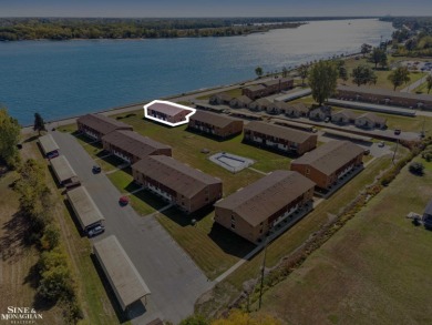 This upper-floor 2-bedroom condo offers beautiful views of the on Marysville Golf Course in Michigan - for sale on GolfHomes.com, golf home, golf lot