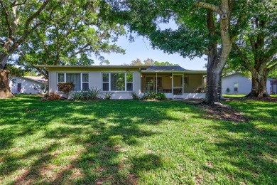 Beautiful home situated on a large and scenic lot with luscious on Highland Lakes Executive Golf Course in Florida - for sale on GolfHomes.com, golf home, golf lot