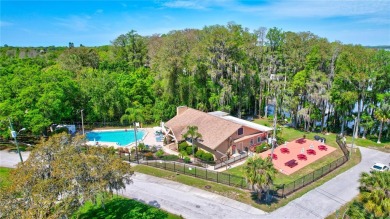 Beautiful home situated on a large and scenic lot with luscious on Highland Lakes Executive Golf Course in Florida - for sale on GolfHomes.com, golf home, golf lot