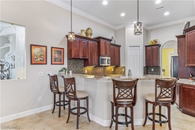 TAKE ADVANTAGE OF THIS HUGE PRICE ADJUSTMENT!! THIS TROPICAL on River Hall Country Club in Florida - for sale on GolfHomes.com, golf home, golf lot