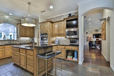 Exceptional custom stone and brick home on nearly one acre in on Mira Vista Country Club in Texas - for sale on GolfHomes.com, golf home, golf lot