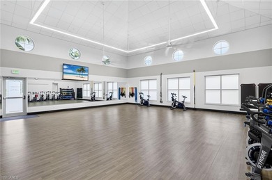 Beautifully updated first-floor coach home featuring luxury on Pelican Sound Golf and River Club in Florida - for sale on GolfHomes.com, golf home, golf lot