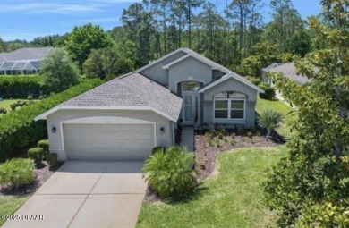 Nestled on a quiet, no-through street in Plantation Bay's on Plantation Bay Golf and Country Club in Florida - for sale on GolfHomes.com, golf home, golf lot