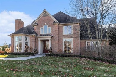 Perched gracefully above the landscape, this Oakhurst residence on Oakhurst Golf and Country Club in Michigan - for sale on GolfHomes.com, golf home, golf lot