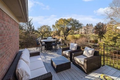 Perched gracefully above the landscape, this Oakhurst residence on Oakhurst Golf and Country Club in Michigan - for sale on GolfHomes.com, golf home, golf lot