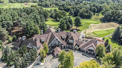 Perched gracefully above the landscape, this Oakhurst residence on Oakhurst Golf and Country Club in Michigan - for sale on GolfHomes.com, golf home, golf lot