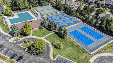 Perched gracefully above the landscape, this Oakhurst residence on Oakhurst Golf and Country Club in Michigan - for sale on GolfHomes.com, golf home, golf lot