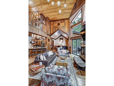 Nestled along the 3rd hole of the Angel Fire Resort Golf Course on Angel Fire Resort Country Club in New Mexico - for sale on GolfHomes.com, golf home, golf lot