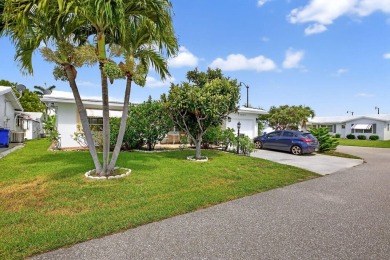 Welcome to this stunning 2-bedroom, 2-bathroom corner home on Leisureville Community Association in Florida - for sale on GolfHomes.com, golf home, golf lot