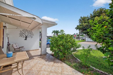 Welcome to this stunning 2-bedroom, 2-bathroom corner home on Leisureville Community Association in Florida - for sale on GolfHomes.com, golf home, golf lot