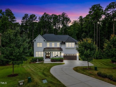 Behind the gates of Hasentree Country Golf Club community on Hasentree Club in North Carolina - for sale on GolfHomes.com, golf home, golf lot