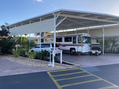 RV lot with double port, full hookups, shed with washer and on Deer Creek RV Golf Resort in Florida - for sale on GolfHomes.com, golf home, golf lot