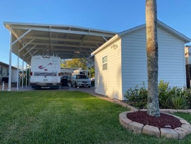 RV lot with double port, full hookups, shed with washer and on Deer Creek RV Golf Resort in Florida - for sale on GolfHomes.com, golf home, golf lot