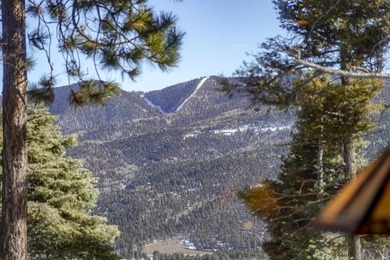 Take in big ski mountain views at 14 Sierra Blanca Cir. This on Angel Fire Resort Country Club in New Mexico - for sale on GolfHomes.com, golf home, golf lot