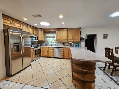 Spacious and versatile, this nearly 3,000 sq ft home is perfect on Riviera Country Club in Florida - for sale on GolfHomes.com, golf home, golf lot