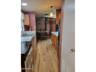 This is a lovely 2 bedroom 2 bath partially furnished home on 3 Parks Fairways in Arizona - for sale on GolfHomes.com, golf home, golf lot