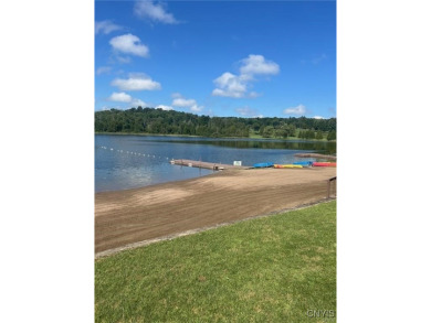 Discover the charm of this cozy tiny log home nestled in the on Cedar Lake Club in New York - for sale on GolfHomes.com, golf home, golf lot