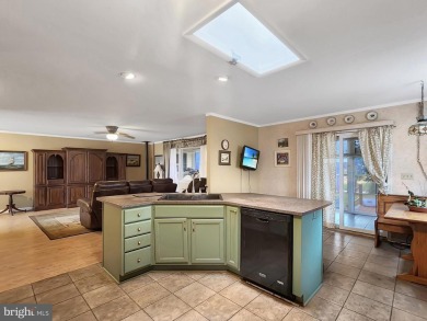 This single story ranch home situated off of the first fairway on Captains Cove Golf and Yacht Club in Virginia - for sale on GolfHomes.com, golf home, golf lot