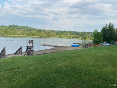 Discover the charm of this cozy tiny log home nestled in the on Cedar Lake Club in New York - for sale on GolfHomes.com, golf home, golf lot