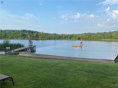 Discover the charm of this cozy tiny log home nestled in the on Cedar Lake Club in New York - for sale on GolfHomes.com, golf home, golf lot